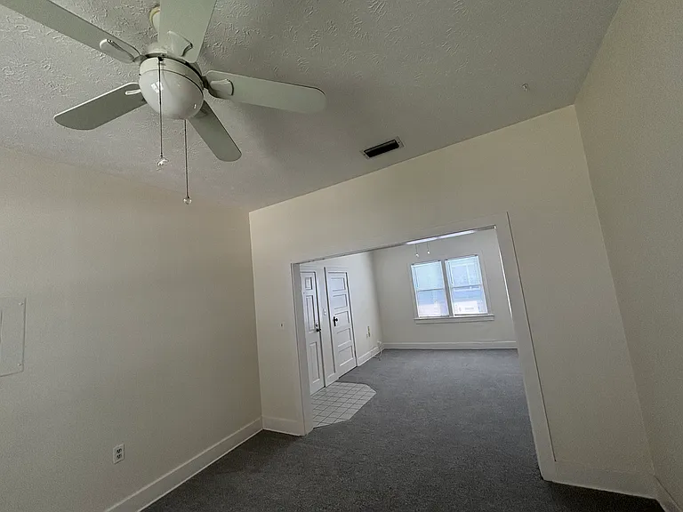 Living room view into dining room