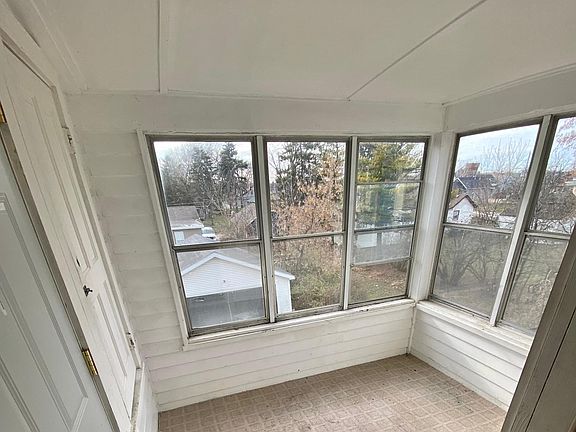 3 Seasons porch off the kitchen, with extra outdoor storage. Back of House