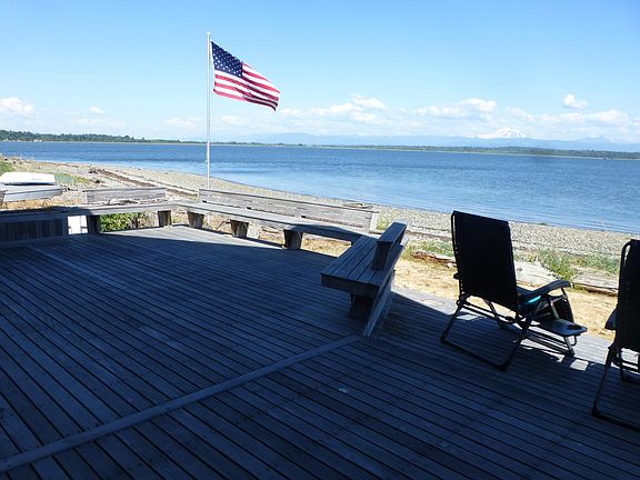 Bench seating on deck, deck recliner chairs and patio furniture to fully enjoy the entertainment size deck.