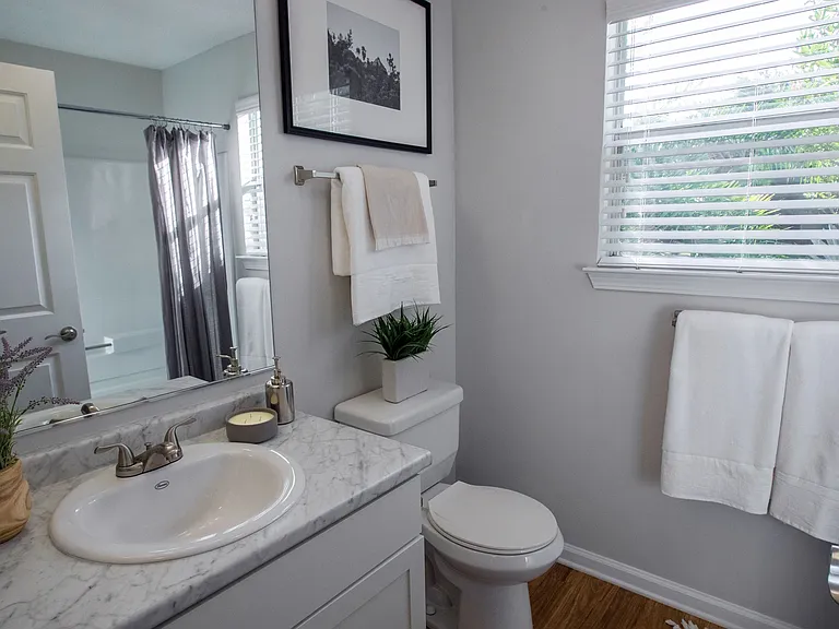 Enjoy natural lighting while you get ready in our spa-like bathroom with window and stylish features throughout.