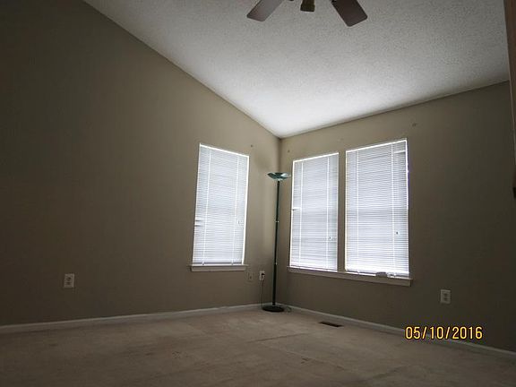 large master bedroom with cathedral ceilings