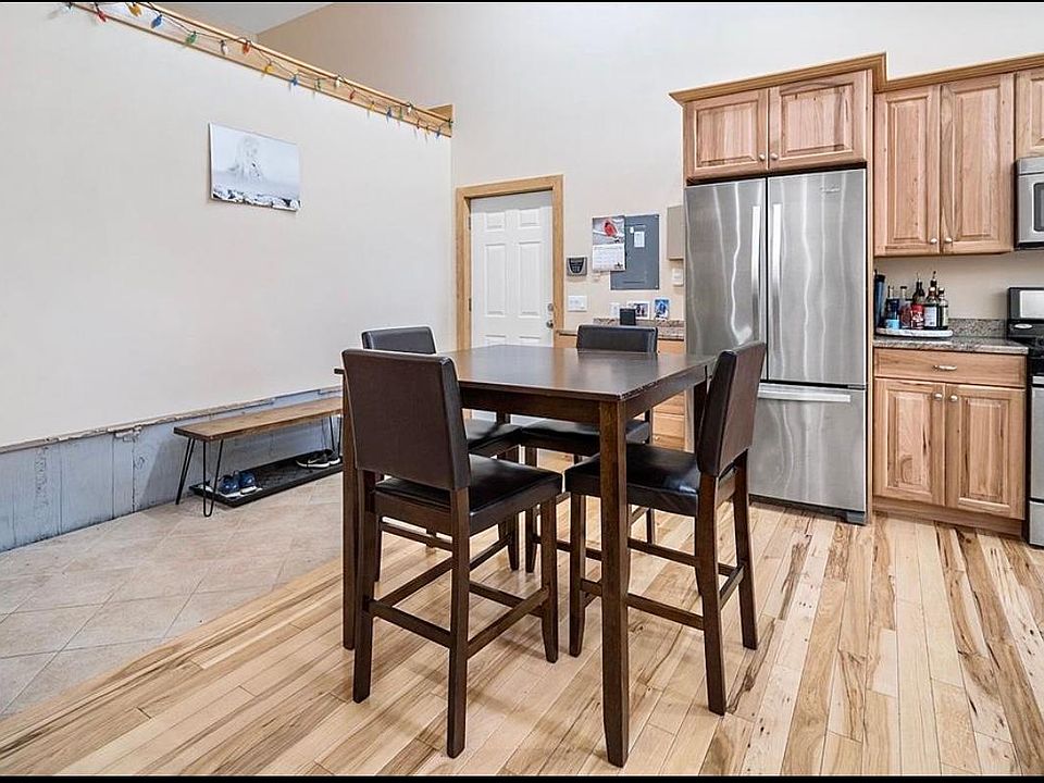 Entry with tile floors to hardwoods into kitchen