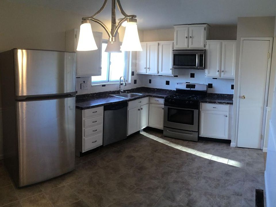 Newly Updated kitchen with tile floor and backsplash.Stainle