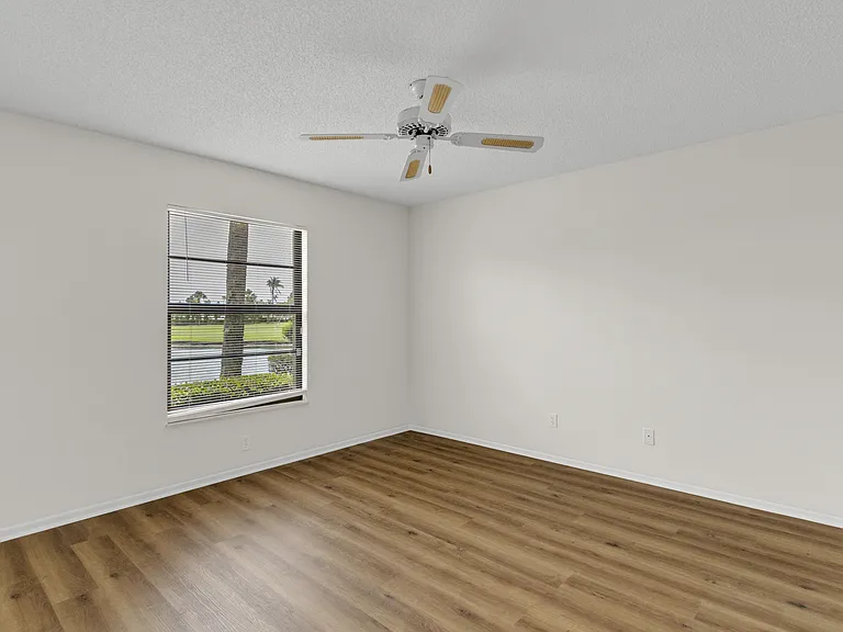 Entering the spacious Primary Bedroom w/ HUGE walk-in closet