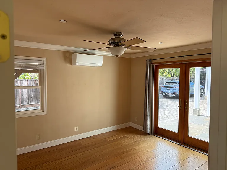 Large bedroom with AC and french doors on to patio.