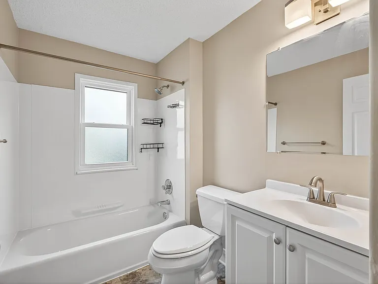 Updated Full Bathroom with modern vanity and fixtures.