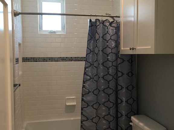 Full Bath, with Tub and Shower. Built-in cabinetry.