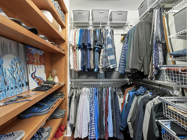 Custom closet with drawers, baskets, and safe.