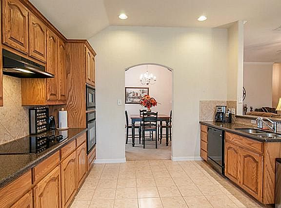 Ceramic-Tiled Kitchen Features Beautiful Cabinetry, Granite-Type Counters & Built-In Appliances