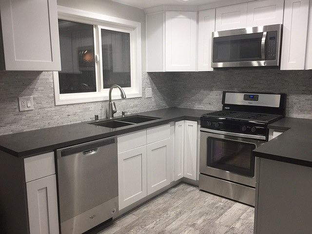 New kitchen with stainless steel appliances