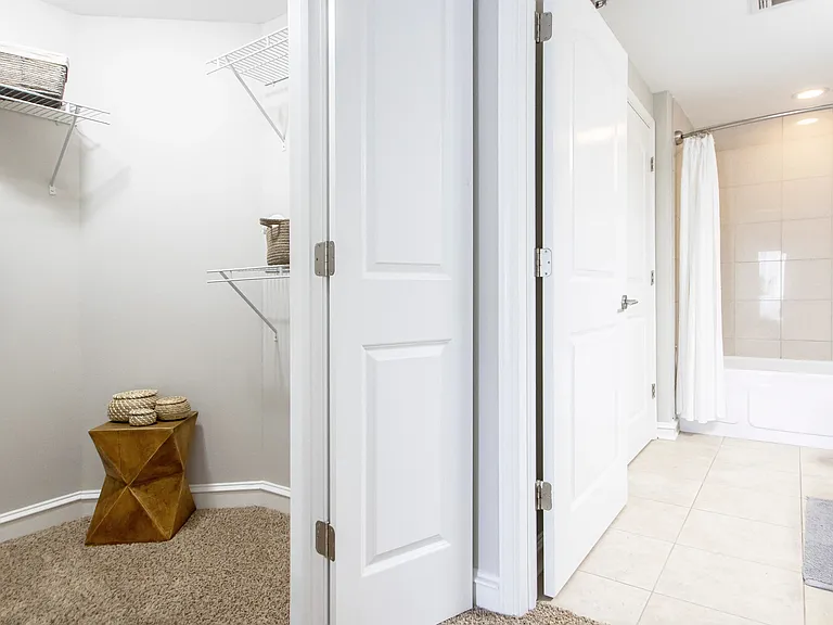 In your master suite, you'll relish our magnificent adjoining oversized walk-in closet with luscious carpeting and an adjacent, spacious bathroom for an immaculate living experience.