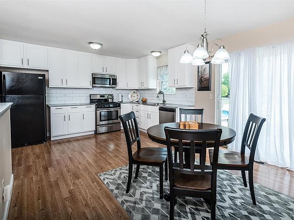 Remodeled kitchen and breakfast area with granite counters and 42" cabinets