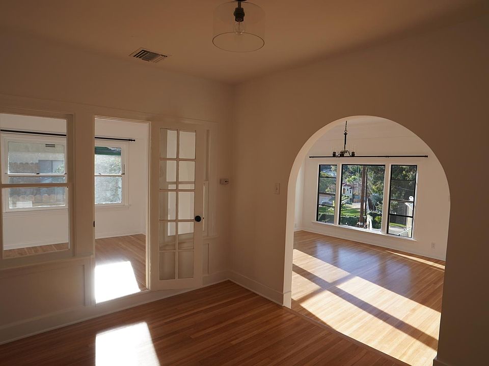Standing in dining room looking toward living room and sunroom/office/second bedroom.