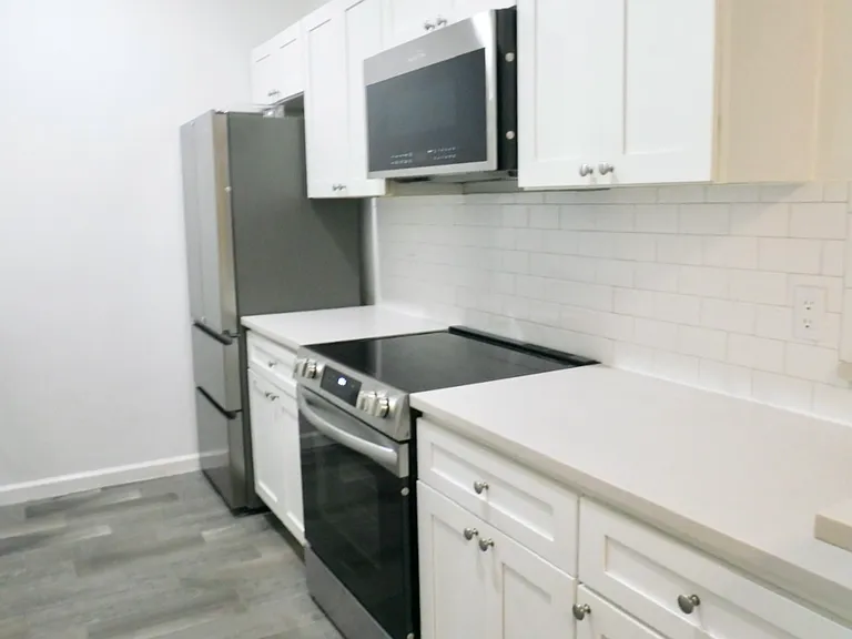 Beautifully Updated Kitchen with Quartz Countertops and Stainless Appliances