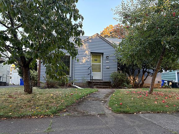 Street view - so much cuter in person! The trees provide great outdoor living space but make pictures tricky.