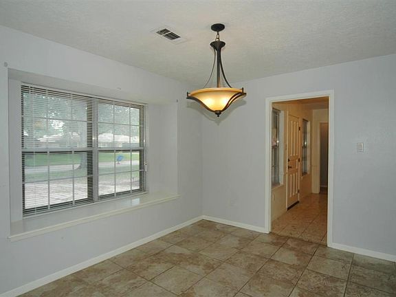  Formal dining with tile flooring and updated light fixture