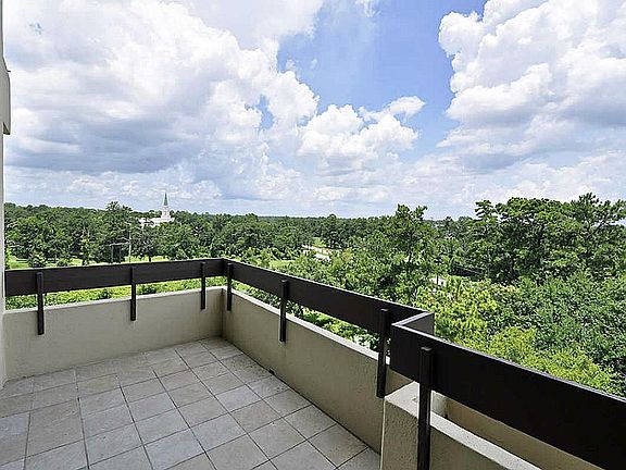 Throw open the terrace doors and enjoy the tree top views of the upscale Champion Forest area. The o