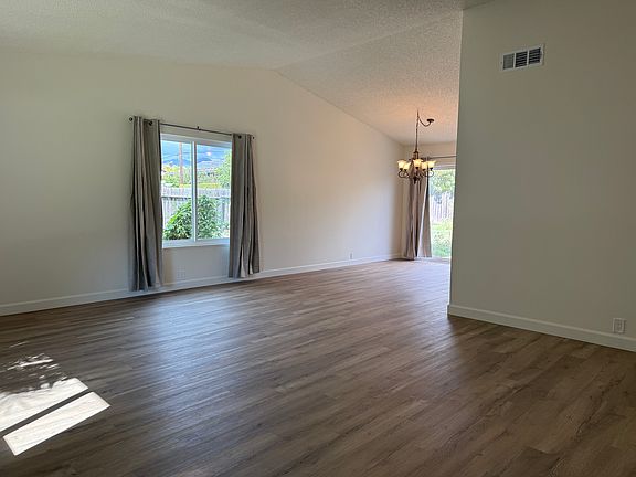 View of the living room and dining area from the front door