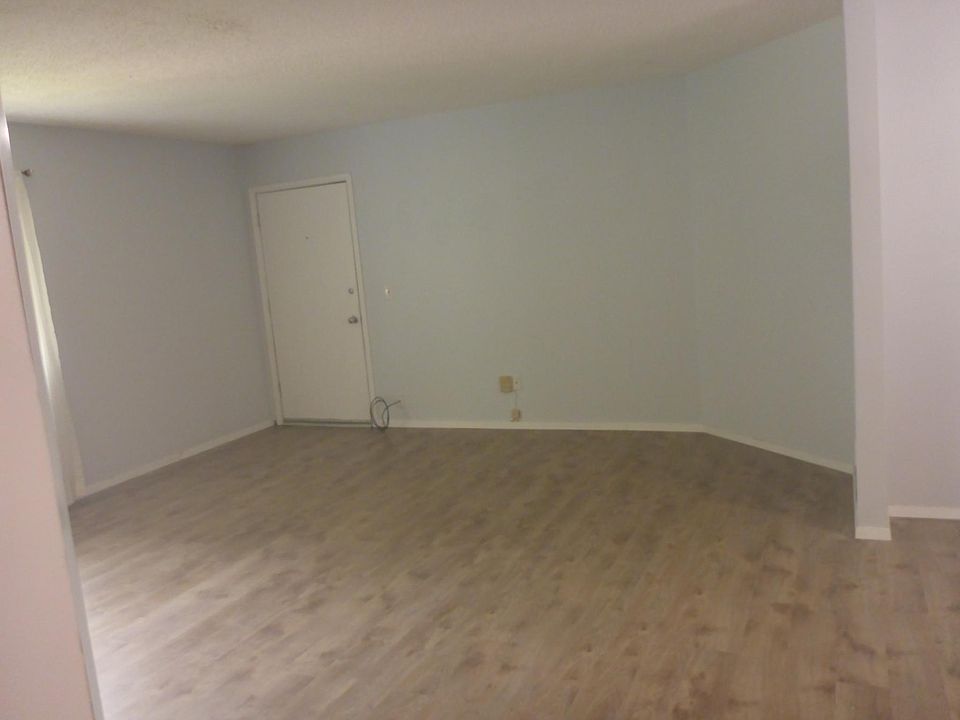 View of living room including front door.