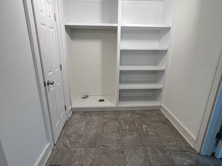 New pantry and broom/storage closet in kitchen area. 1/2 bath behind door on the left.