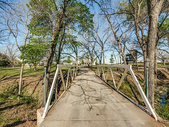 This 44 foot long steel tressel bridge leads you to the circle drive way in front of the home.