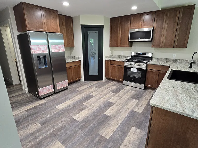 Kitchen with corner pantry