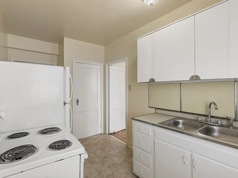 Raleigh kitchen with white appliances and white cabinetry