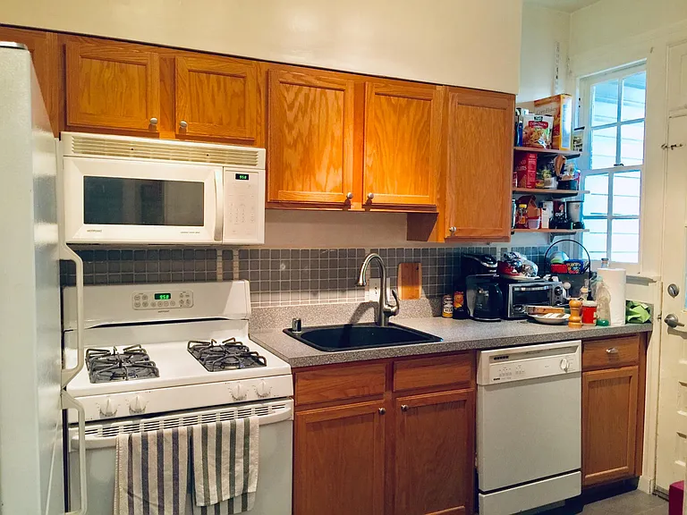 Microwave, Gas range, disposal & dishwasher, water filter. Rear door to mudroom (1st floor) or porch (2nd level)