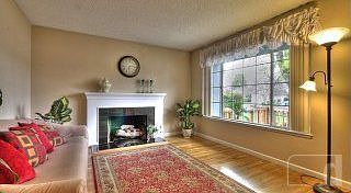 Spacious Living area with gas fireplace, hardwood floors