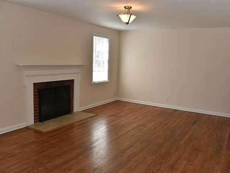 Living room: Refinished oak floors, fireplace, new lighting