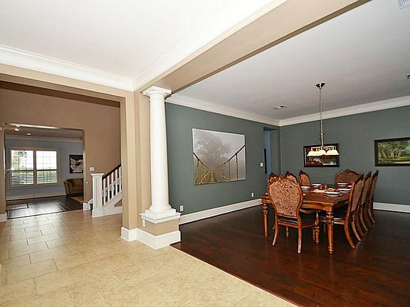 Extended tile entry leads past the large (18x15) formal dining room with recent wood flooring.