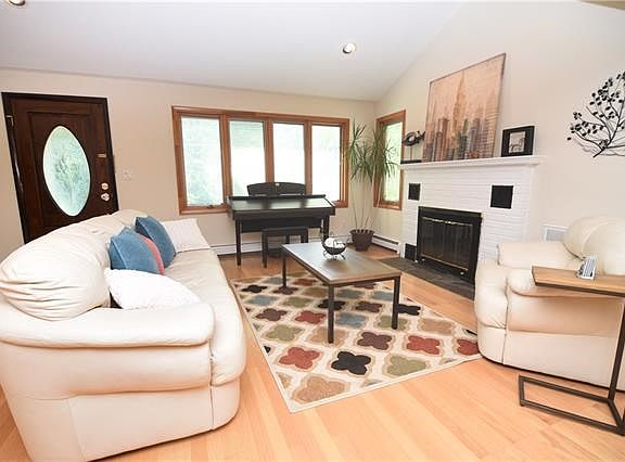 Enter the main living area with fireplace.