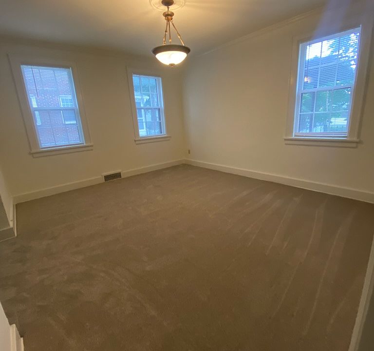 Formal dining room with 3 large windows