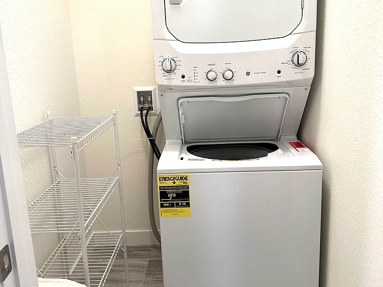 The separate laundry room has its own door for added privacy and noise reduction. It also offers plenty of storage space for laundry supplies and other household essentials.