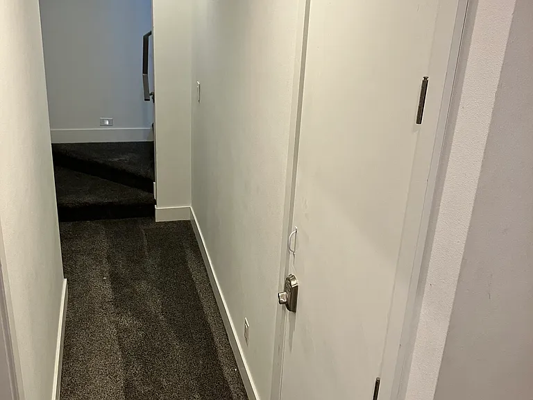 Basement hall from garage: security storage for safes, guns etc