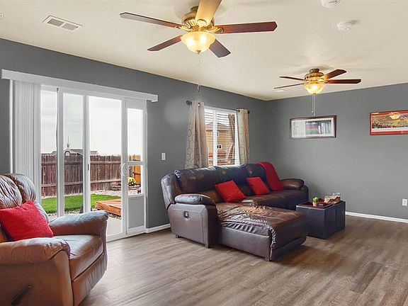 The family room with a walk-out to the fully fenced backyard!