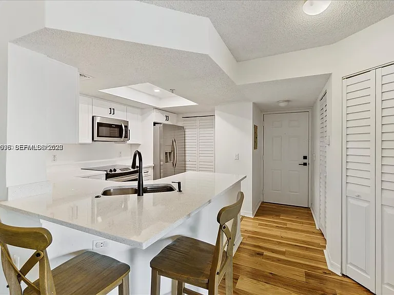 5065 Wiles Rd #308 — Photo 10