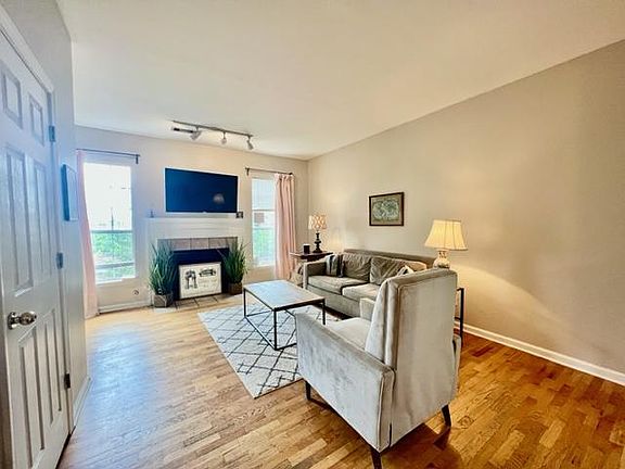 The living room. The door on the left is the half bath.