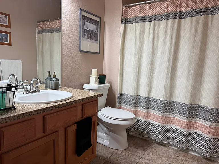 First Full Sized Bath with Granite Countertops and Tile Flooring