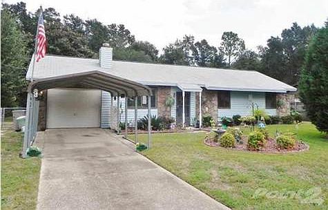 Welcome to 7332 Kipling St. Long driveway, Carport & Single car garage.