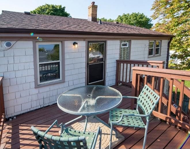 View of deck and front of apartment