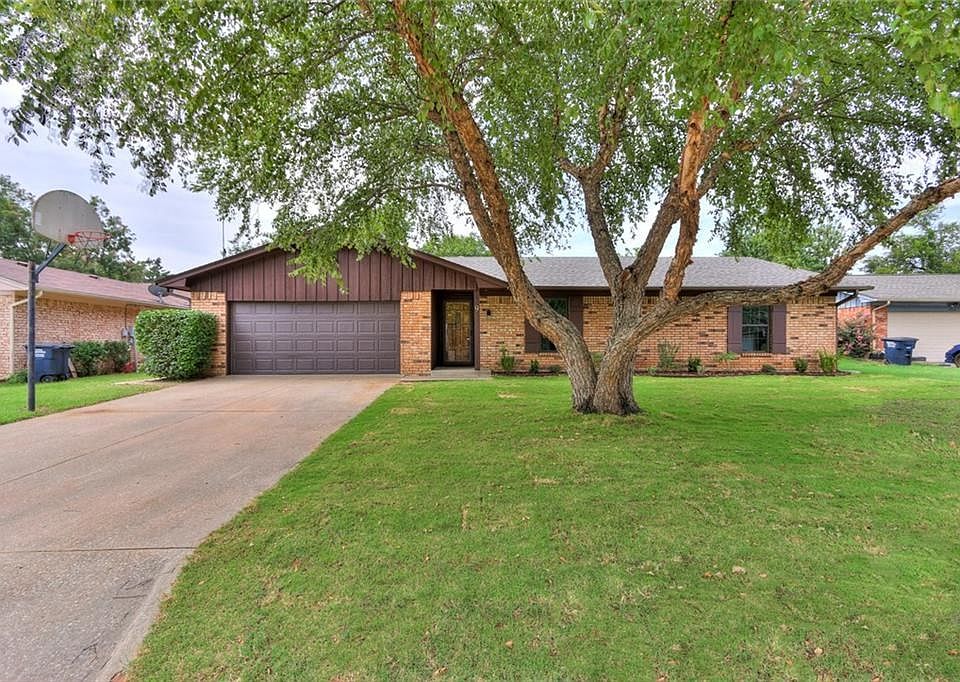 Fresh exterior paint, new gutters, some new sod, and a shade tree create excellent curb appeal!