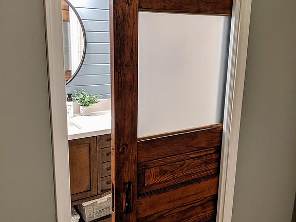 Master bath: Pocket door with frosted glass (rescued/restored from a regional school) has "soft-close" on both open and shut -- closes quietly (no noisy slams) and protects little fingers.