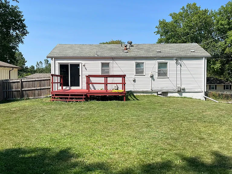 Large fenced in back yard and deck