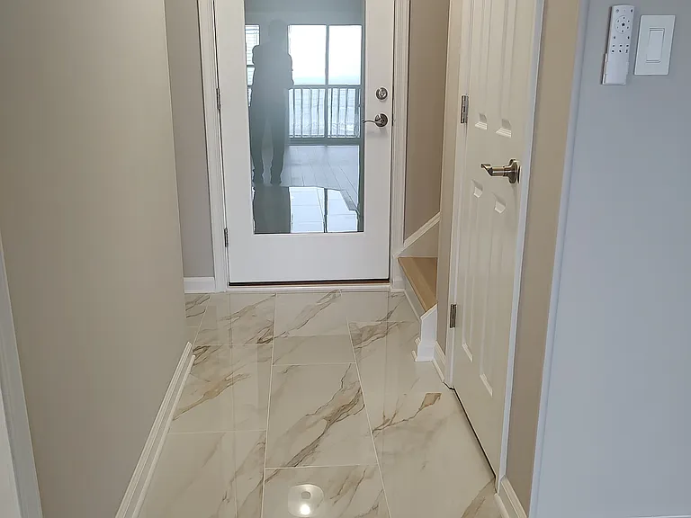 Front Entryway w Designer Tile & Custom Entry way Door