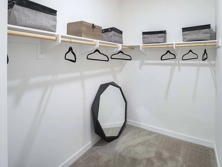 Keep your belongings organized and easily accessible in a spacious closet with plenty of room for all your essentials.