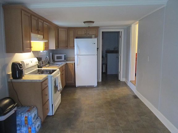 cabinets are appox 3 years old,lazy suzan,stove and refrigerator comes with house