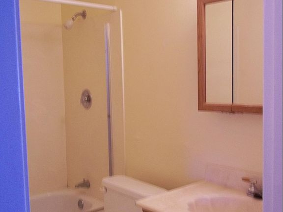 Hall bathroom with tile floor.