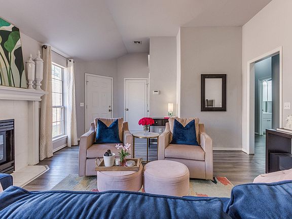 LIving room features a ceiling fan and hard surface floors