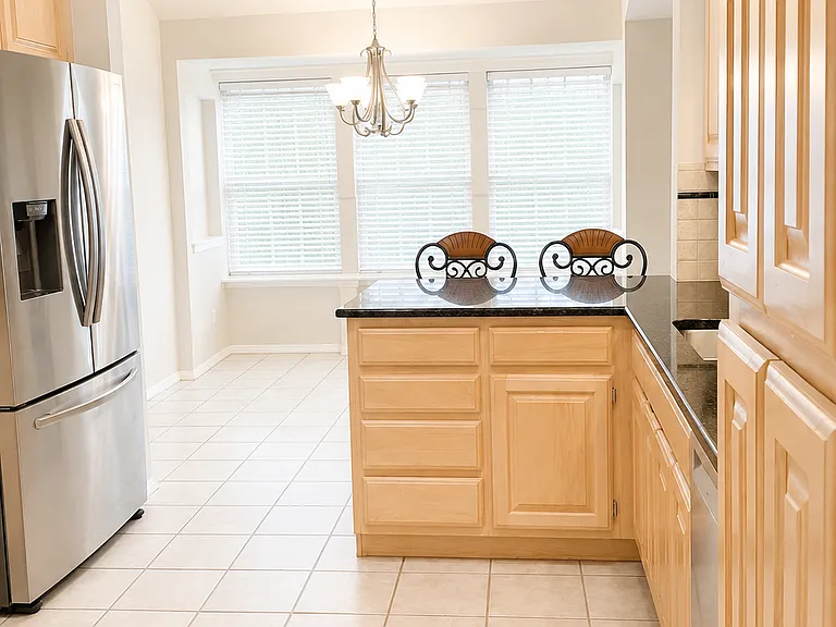Kitchen, stainless steel appliances. Granite countertops.
